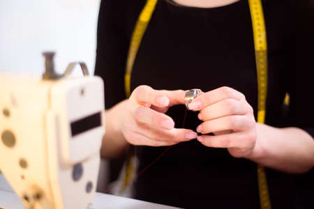 Process of working with sewing machine in an atelier.の写真素材