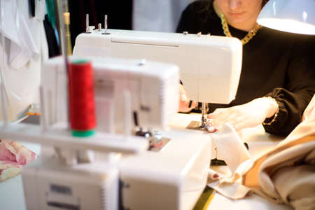 Process of working with sewing machine in an atelier.の写真素材