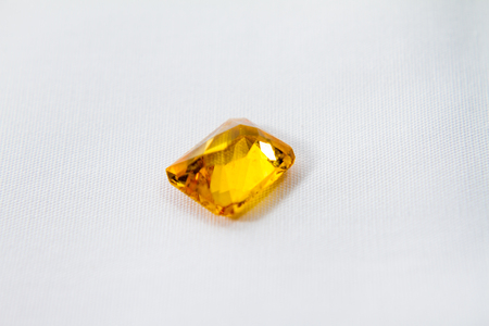 Yellow sapphire with white isolated background