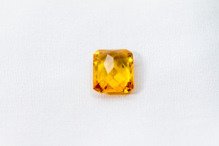 Yellow sapphire with white isolated background