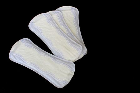 Stack of sanitary napkins isolated on white backgroundの写真素材