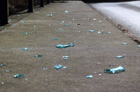 Broken glass on the sidewalkの写真素材