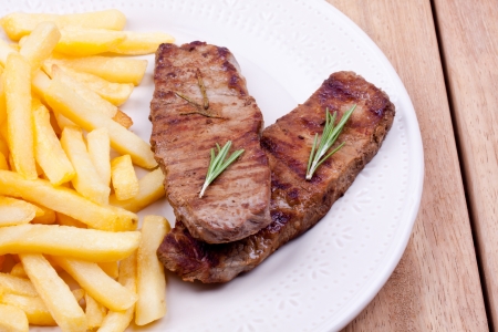 grilled steak and french friesの写真素材