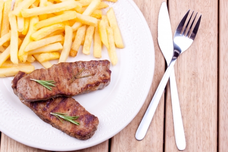 grilled steak and french friesの写真素材