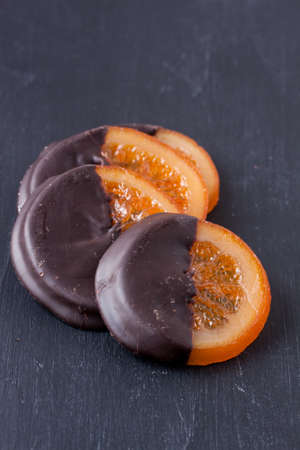 slices of orange coated chocolateの写真素材