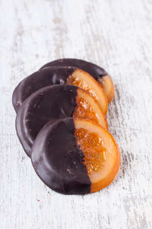 slices of orange coated chocolateの写真素材