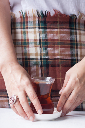 Black tea serving with Turkish tea glassの写真素材