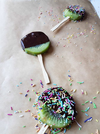 chocolate fondue and kiwi, sugar sprinklesの写真素材