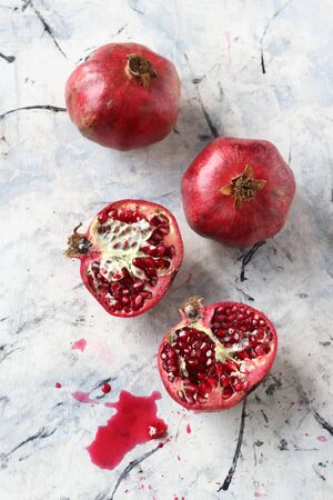 Pomegranate fruits on a white backgroundの写真素材