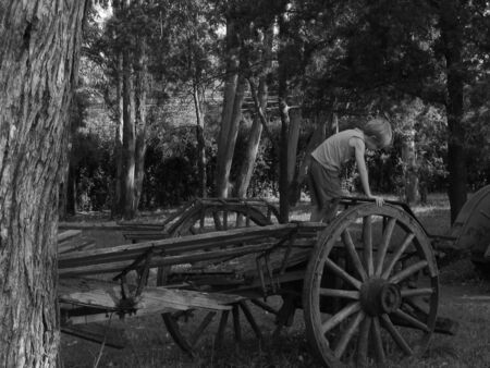 boy on an old wagonの写真素材