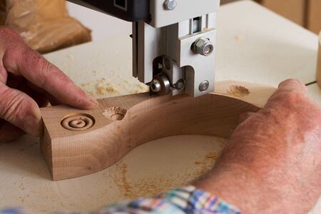 Carpenter tools on wooden table with sawdust. Circular Saw. Carpenter workplace top view.の写真素材