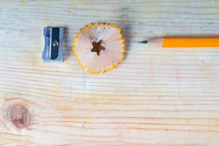 Pencil sharpener shavings on a wooden table. Back to schoolの写真素材