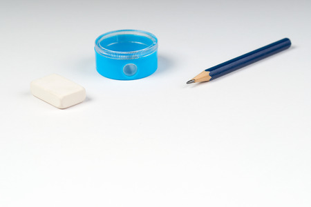 Pencil sharpener and elastic on the white paper. Back to school.の写真素材