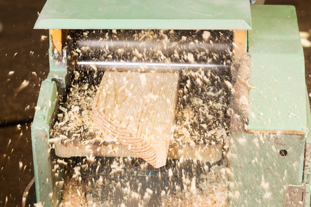 Carpenter tools on wooden table with sawdust. Circular Saw. Carpenter workplace top view.