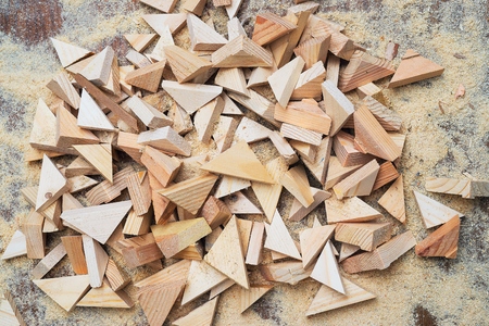 Carpenter tools on wooden table with sawdust.