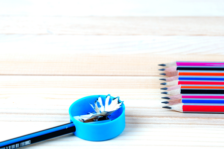 Pencil sharpener shavings on a wooden table. Back to school. Copy space.の写真素材