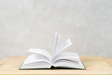 Open book on wooden table. Back to school. Copy space.の写真素材