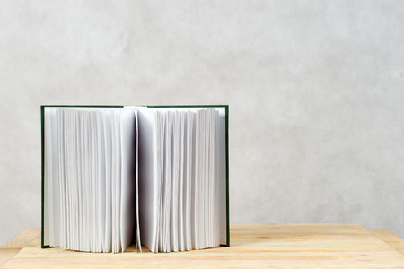 Open book on wooden table. Back to school. Copy space.の写真素材
