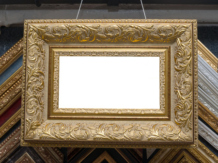 Craftsman working on frame in frameshop. Professional framer hand holding frame angle. Top view.