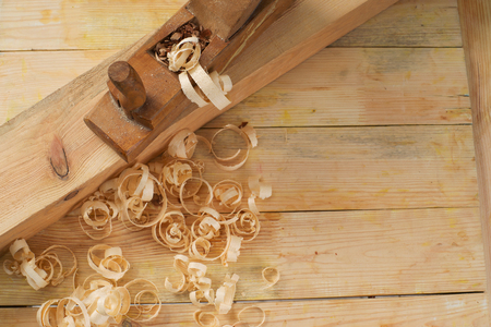Carpenter tools on wood table background. Top view. Copy space.