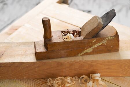 Carpenter tools on wood table background. Top view. Copy space.