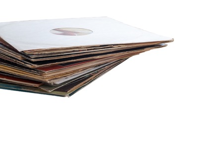 Vinyl record with copy space in front of a collection of albums dummy titles, vintage process