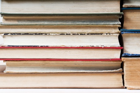Stack of hardback books, close-up. Back to school. Copy space.の写真素材