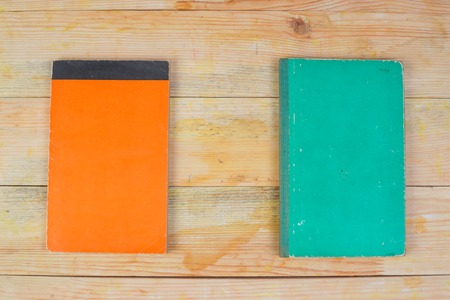 Hardback book on wooden table. Back to school. Copy space.の写真素材