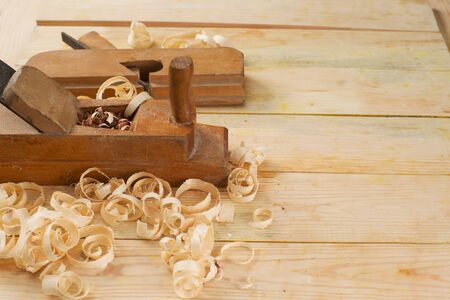 Carpenter tools on wood table background. Top view. Copy space.
