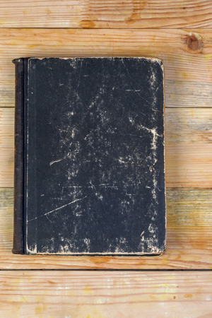 Hardback book on wooden table. Back to school. Copy space.の写真素材