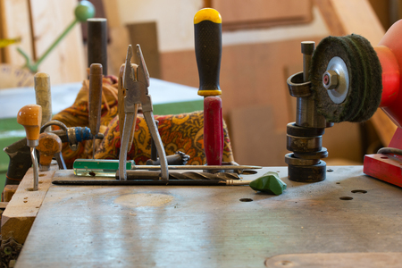 Carpenter tools on wooden table with sawdustの写真素材