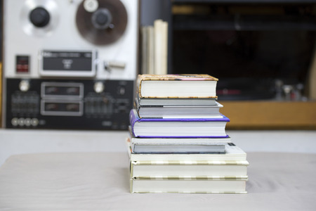 Book, stack of hardback books on table. Top view.の写真素材