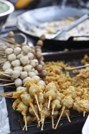 Skewered fried meat and balls on sticksの写真素材