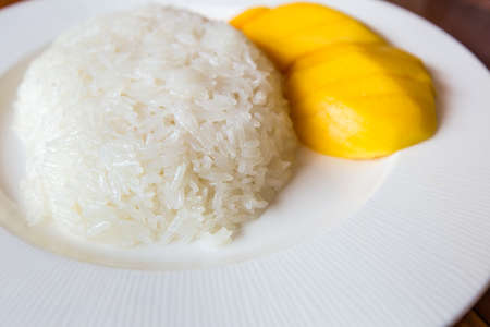 Thai style tropical dessert, glutinous rice eat with mangoes,Mango sticky riceの写真素材