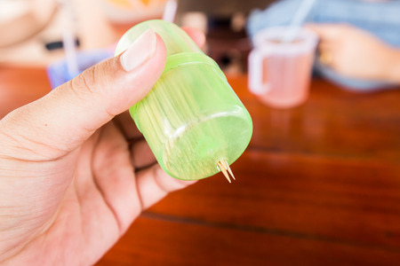 hands of men taking a toothpickの写真素材