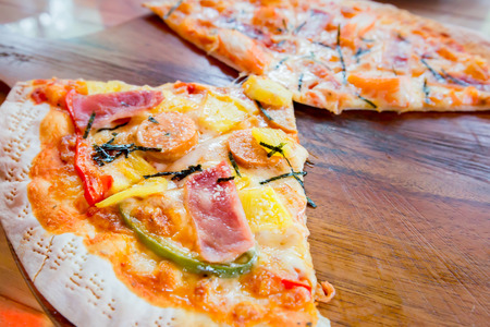Hawaiian pizza homemade on the wooden table.の写真素材