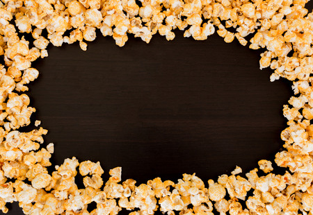 frame of popcorn on black background.の写真素材