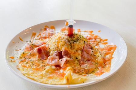 Omelette rice with bacons, cheese and prawns, fusion food, selective focusの写真素材