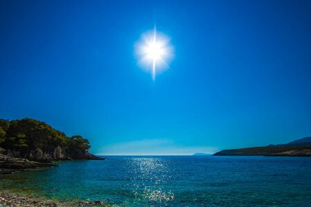 shining sun on the beach in blueの写真素材