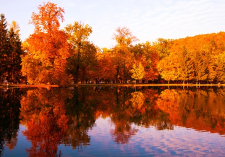 Beautiful colors of autumn landscape by the lakeの写真素材