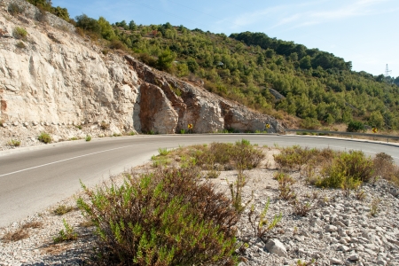 winding road in deserted landscape in vis islandの写真素材