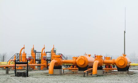 orange gas pipe in frosted winterの写真素材