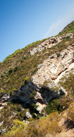 rocky scrubby landscape from vis island  croatia の写真素材