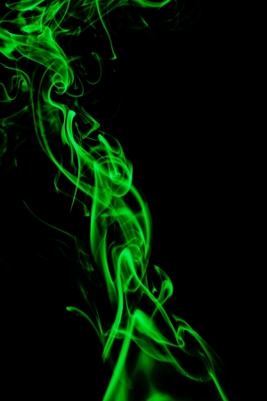 green smoke in black backgrounの写真素材