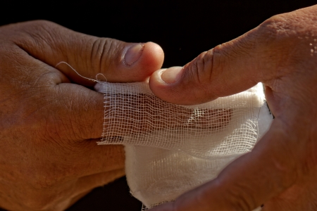 white medicine bandage on injury fingerの写真素材