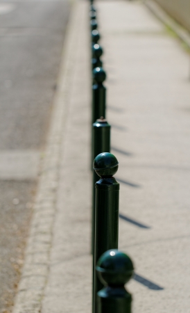 green columns at the edge of the roadの写真素材