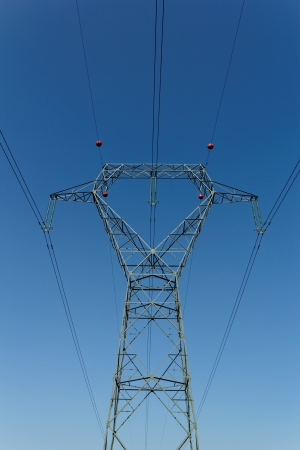 Detail of electricity pylon against blue sky の写真素材
