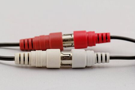 correct conection between left - right audio RCA cable on a white background (red white)の写真素材