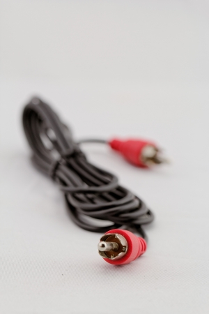 only red audio RCA cable on a white background (left)の写真素材
