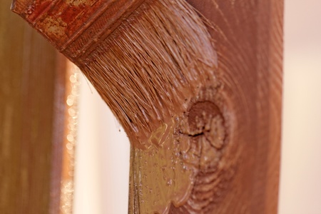 planks fence dyeing with brown paint and brushの写真素材